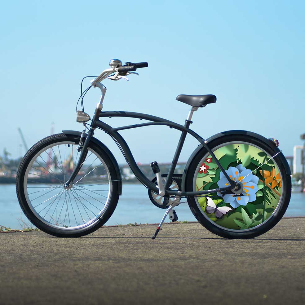 Vélo de collection Canopée. Vélo de ville Cruiser avec une roue arrière au design floral. Roue lenticulaire du plus bel effet pour des trajets en toute simplicité